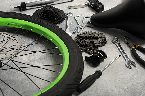 istock Parts of bicycle and tools on grey background, closeup 2208438680