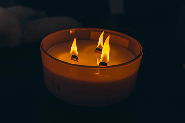 istock Three-wick candle symbolizing release and atmosphere of calm and serenity 2208441036