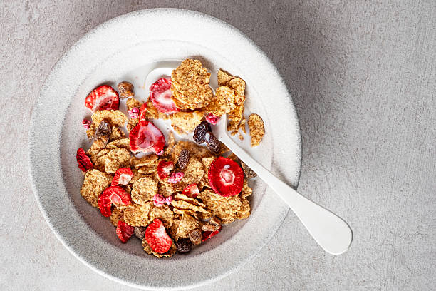 A bowl of toasted wheat cereal with freeze dried strawberries