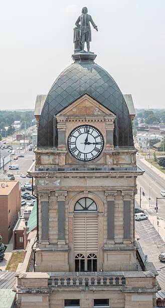 istock Historic clock tower with statue in small town 2208444800