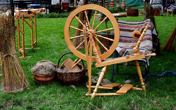 istock A close up on a medieval stand showing numerous tools and equipment used for weaving, making clothes, and creating cloth by manual means shown during a historic fair in Poland 2208447536