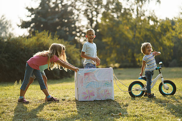 Children playing at home during a blackout using alternative lighting.
