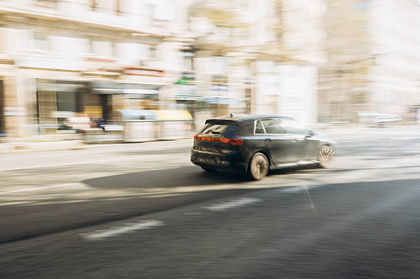 istock Car in motion on a city street 2208449848