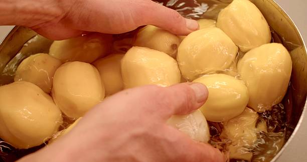 istock Freshly Peeled Potatoes in a Bowl Ready and Prepared for Cooking 2208453117