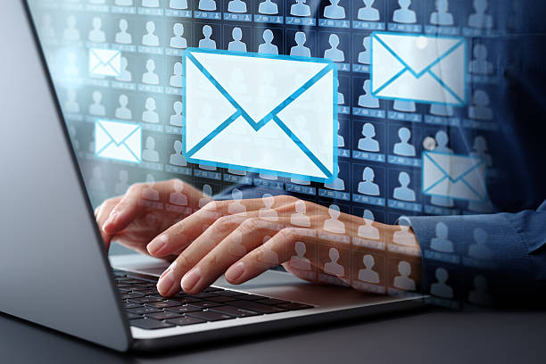 Email marketing automation technology and customer database. Businessman typing on laptop computer keyboard at desk in office. Email marketing automation technology and customer database. Businessman typing on laptop computer keyboard at desk in office. process automation office stock pictures, royalty-free photos & images