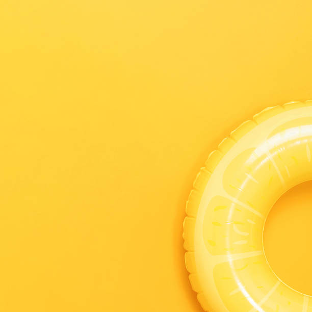 istock Summer background with yellow inflatable swim ring and copy space for text 2208459826