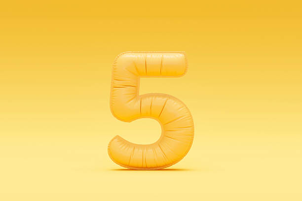 istock Number 5 balloon on yellow background 2208467601
