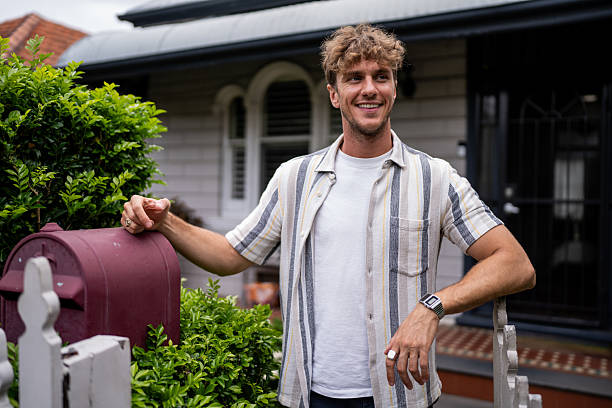 istock Handsome Man in Front of His House 2208467833