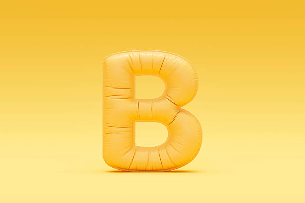 Letter B balloon yellow colored foil uppercase on yellow background. Digitally generated image. 3d render.