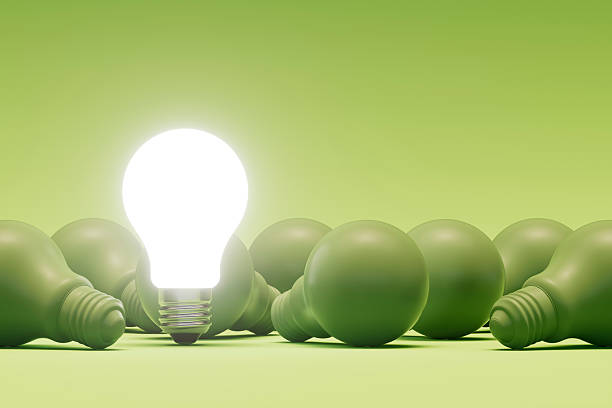A digitally generated image featuring green-colored light bulbs, symbolizing sustainability, energy efficiency, and environmentally friendly innovation. This vibrant and meaningful design highlights the shift toward green technology and conscious energy use, making it ideal for eco-themed visuals, clean energy projects, and environmental campaigns.