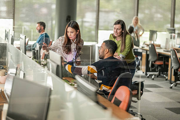 istock Diverse Team Collaborating in Modern Open Concept Office Environment 2208470172