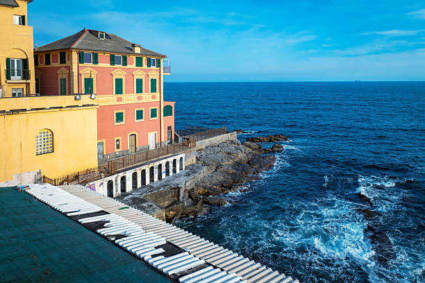 Genoa cityscape in early morning fog and rain. View from the sea.