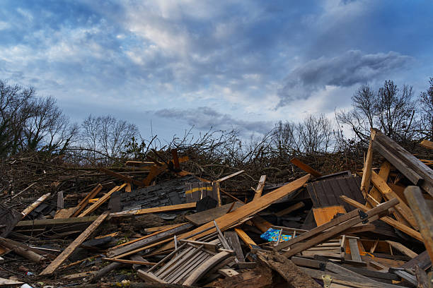 istock Broken furniture and debris are piled high under a dramatic sky 2208471143
