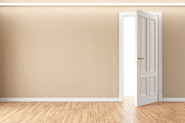 istock Open White Door in Empty Room with Wooden Floor 2208471928