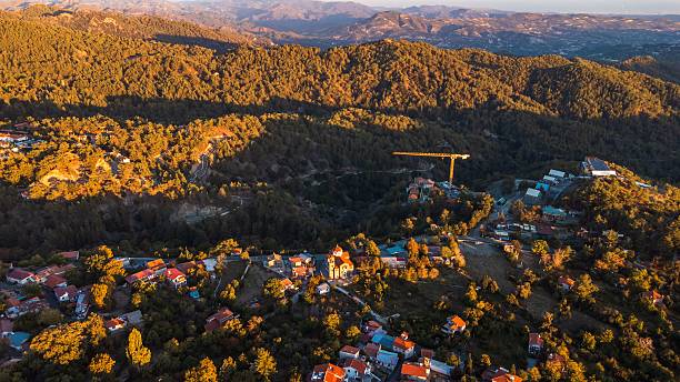 istock Lush green mountains with vibrant rooftops 2208474050