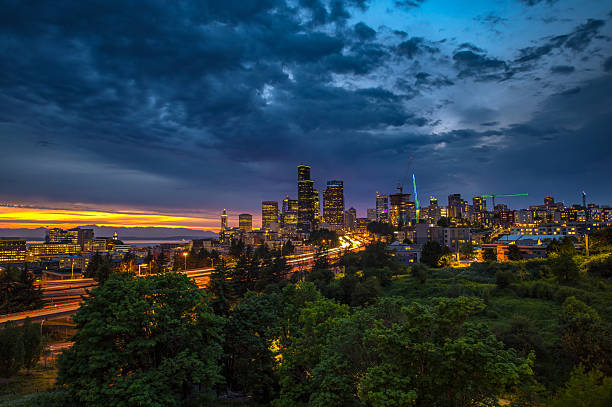 istock Nightfall Over Seattle Skyline with traffic on the I-5 freeway 2208475585