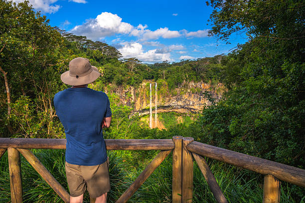 istock Tourist Admiring Chamarel Waterfall in Mauritius 2208475594