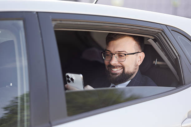 istock Man Businessman Back Seat Car 2208476260