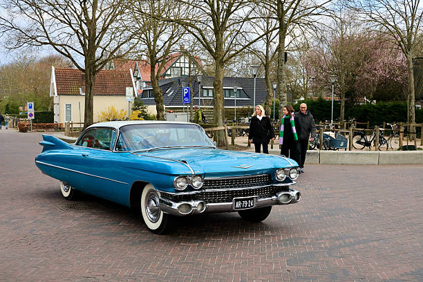 The classic blue Cadillac, likely a 1959 Cadillac Coupe DeVille in Domburg, Zeeland, The Netherlands.