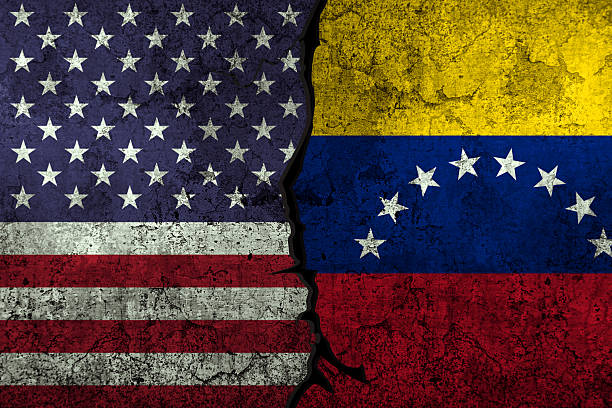 istock USA and Venezuela clashes over business and trade, conflict concept backdrop 2208477639