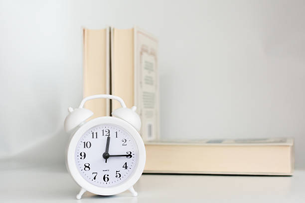 istock books and an alarm clock 2208479982