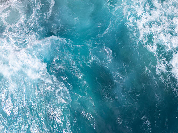 istock Sea surf turquoise waves top view 2208480009