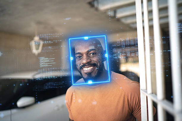 istock Smiling man identified by facial recognition technology at home garage 2208486417