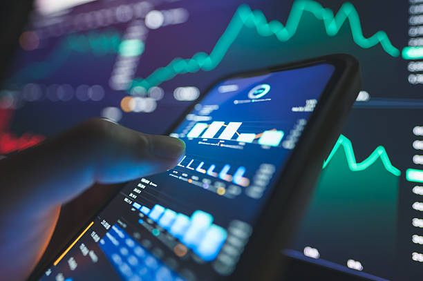 istock Manage online business offshore trade with mobile app using ticker bid - offer before fundamental analysis and financial graph in stockmarket forex cryptocurrency global invest abstract background 2208487197
