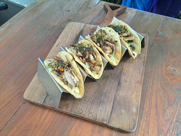 Tasty Red Curry Chicken Taco With Pan Seared Chicken Leg, Red Curry Sauce, Iceberg Lettuce, Aioli, Taco Shell Yoghurt, Sauteed Brunoise Potato And Carrot. Mediterranean Food Menu.