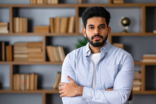 istock Handsome arab man standing with arms crossed gesture at office 2208489579