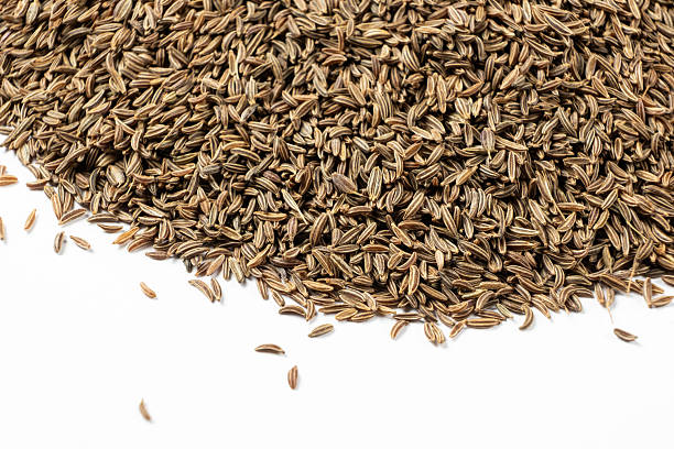 istock Dried Cumin Seeds Close-Up Culinary Ingredient on White Top View 2208490218