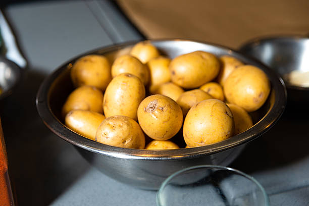 istock Fresh Baby Potatoes in Metal Bowl. 2208491085