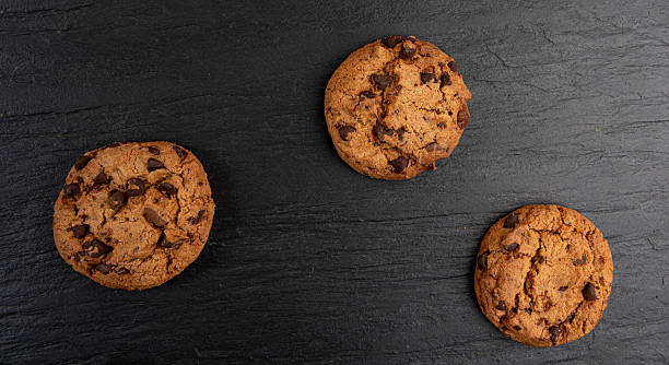 istock Chocolate chips pile cookies , American biscuits, cocoa confectionery cake, sweet morsels bakery 2208491900
