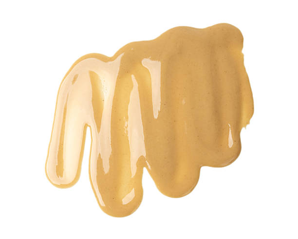 istock Tahini smear isolated, sesame seeds paste splash, spilled tahina sauce, spill eastern dip 2208492293