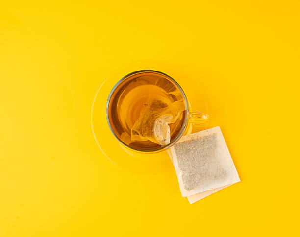 istock Herbal tea sachet in cup, hot water with chamomile and Hypericum or St. John's wort teabag 2208492363