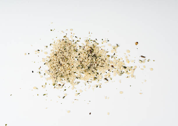 istock Shelled hemp seeds pile isolated, peeled cannabis grains, marijuana kernels without peel 2208492455