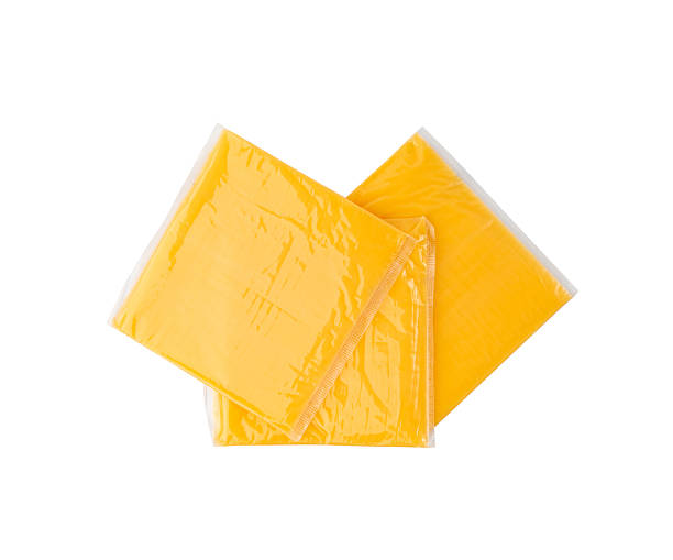 istock American cheese, processed cheese slice, wrapped thin yellow cheddar in a plastic package 2208492600