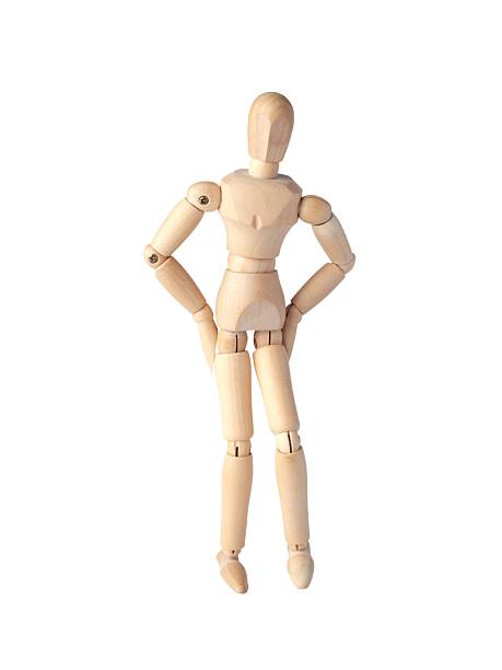 istock A Wooden dummy with hands on the belt, standing confidently. A Poseable figure and Articulated mannequin capture a moment of strength and poise, perfect for artists and creating dynamic, expressive sketches. 2208495794