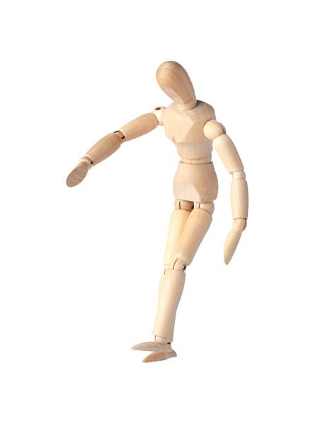 istock A Wooden dummy stands tall, perfectly balanced like a Poseable figure. This Articulated mannequin and Wooden model captures a stable pose, ideal for artists and creating dynamic sketches. 2208495795