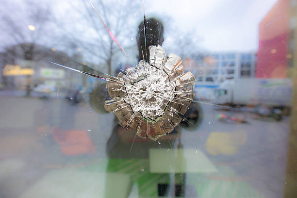 broken window of a shop with hammer or bullet in Berlin