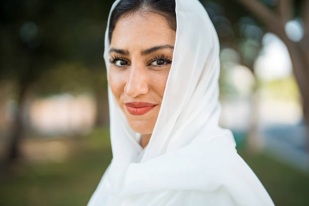 istock Elegant Mixed Race Woman Smiling Outdoors in Soft Natural Lighting 2208501151