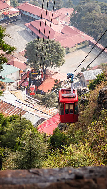 istock Red Cable Car Ascending Over Mountain in Mussoorie, Uttarakhand, India 2208507451