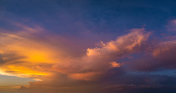 istock Getting dark at sundown. Sunset sky with scattered clouds of bright colors 2208507737