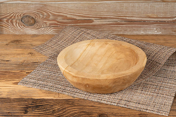 istock Empty wood bowl on table, plate on wooden table and tablecloth, light rustic dish mockup 2208508830