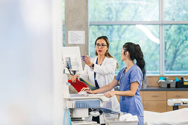 istock Two Female Doctors Using Computer in Medical Clinic 2208510163