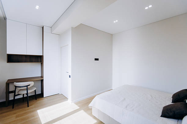 istock A modern minimalist bedroom that elegantly incorporates a comfortable workspace for productivity 2208511133