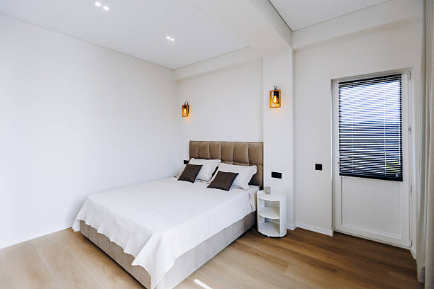 istock Explore a Modern Minimalist Bedroom Design Featuring Abundant Natural Light and Cozy Decor Elements 2208511380