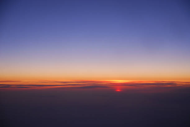 sunrise from horizon seen from air plane in the sky