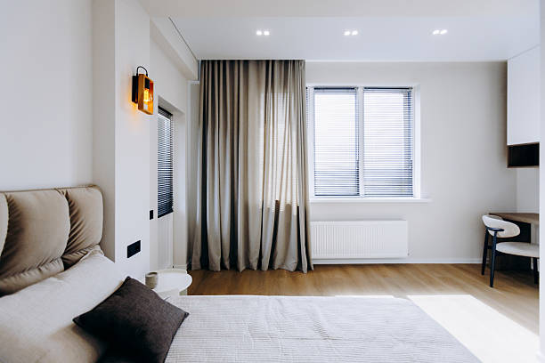 istock A modern bedroom with natural light and elegant decor, blending comfort and style 2208512164