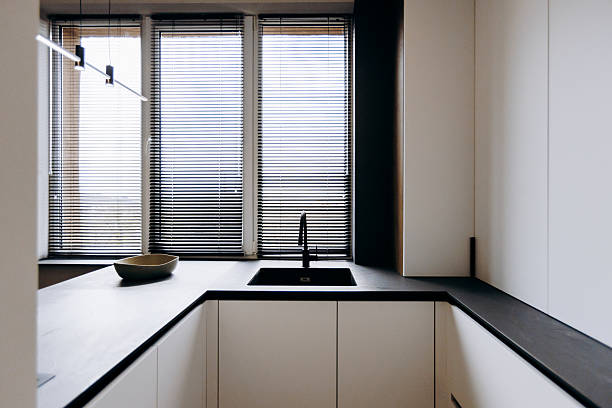 istock Exploring Modern Kitchen Design Featuring Sleek Black Accents and Abundant Natural Light 2208512486